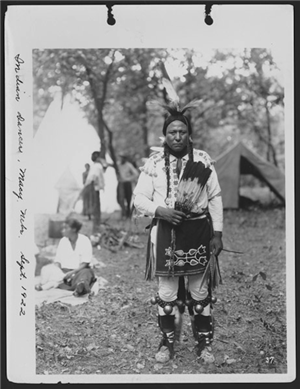 Photo titled Indian Dancer, Macy Nebraska features a Native American in traditional dress